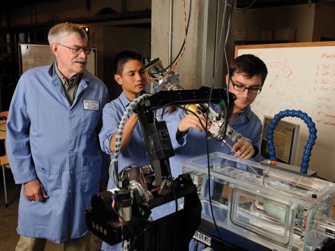 Paul Thienphrapa builds an experimental surgical robot with Russell H. Taylor and Tutkun Sen
